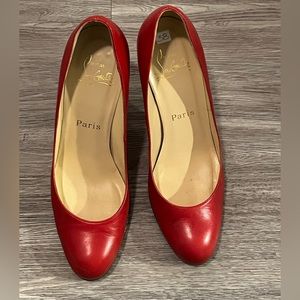 Christian Louboutin red pumps